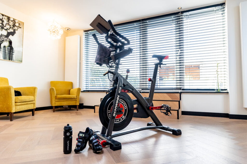A Indoor Cycling bike in the living room. What is Indoor Cycling? 